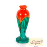 An Art Deco baluster vase with orange and green ru