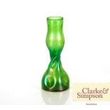 A Loetz green glass bud vase of twisted form, 22cm