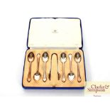 A cased set of six silver teaspoons and sugar nips