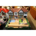 A vintage dolls house (lacking contents) and a box