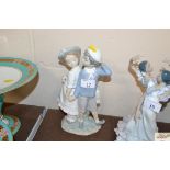 A Lladro figure group depicting a boy and girl