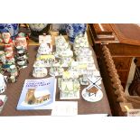 A collection of Coalport porcelain cottages; and a