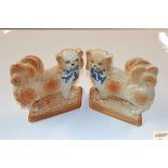 A pair of Staffordshire dog ornaments