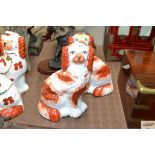 A pair of Victorian Staffordshire seated spaniel o