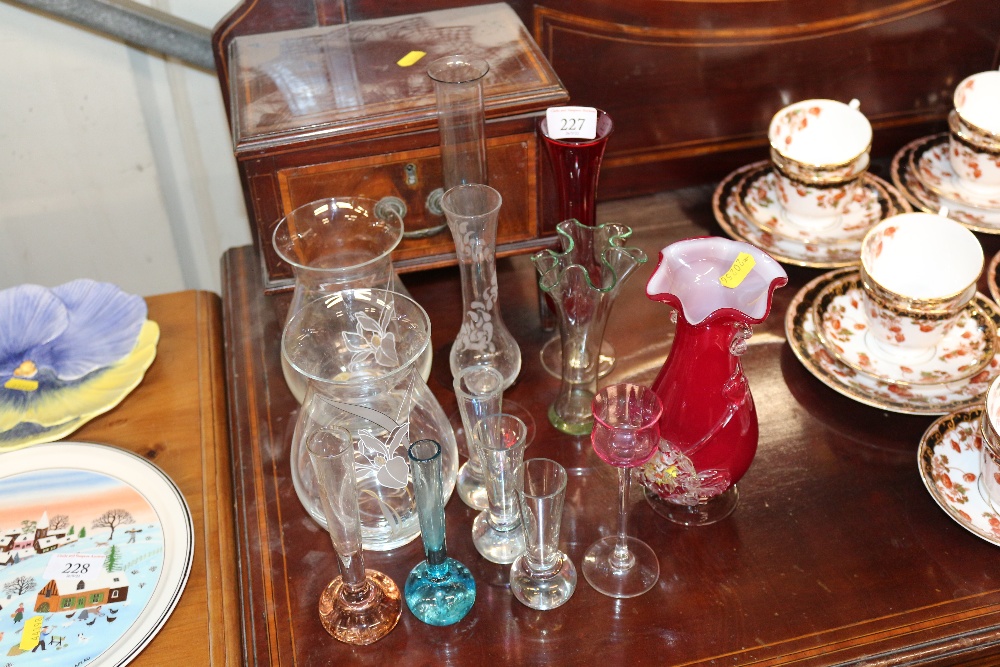 A quantity of various coloured glass vases etc.