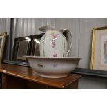 A rose decorated toilet jug and basin