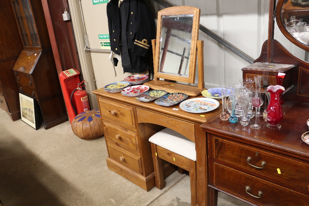 A pine dressing table, swing mirror and stool
