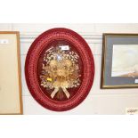 A velvet mounted and framed dried flower arrangeme