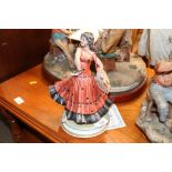 A Capo Di Monte figure of a dancing girl with cert