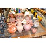 A quantity of various decorative pottery vases and