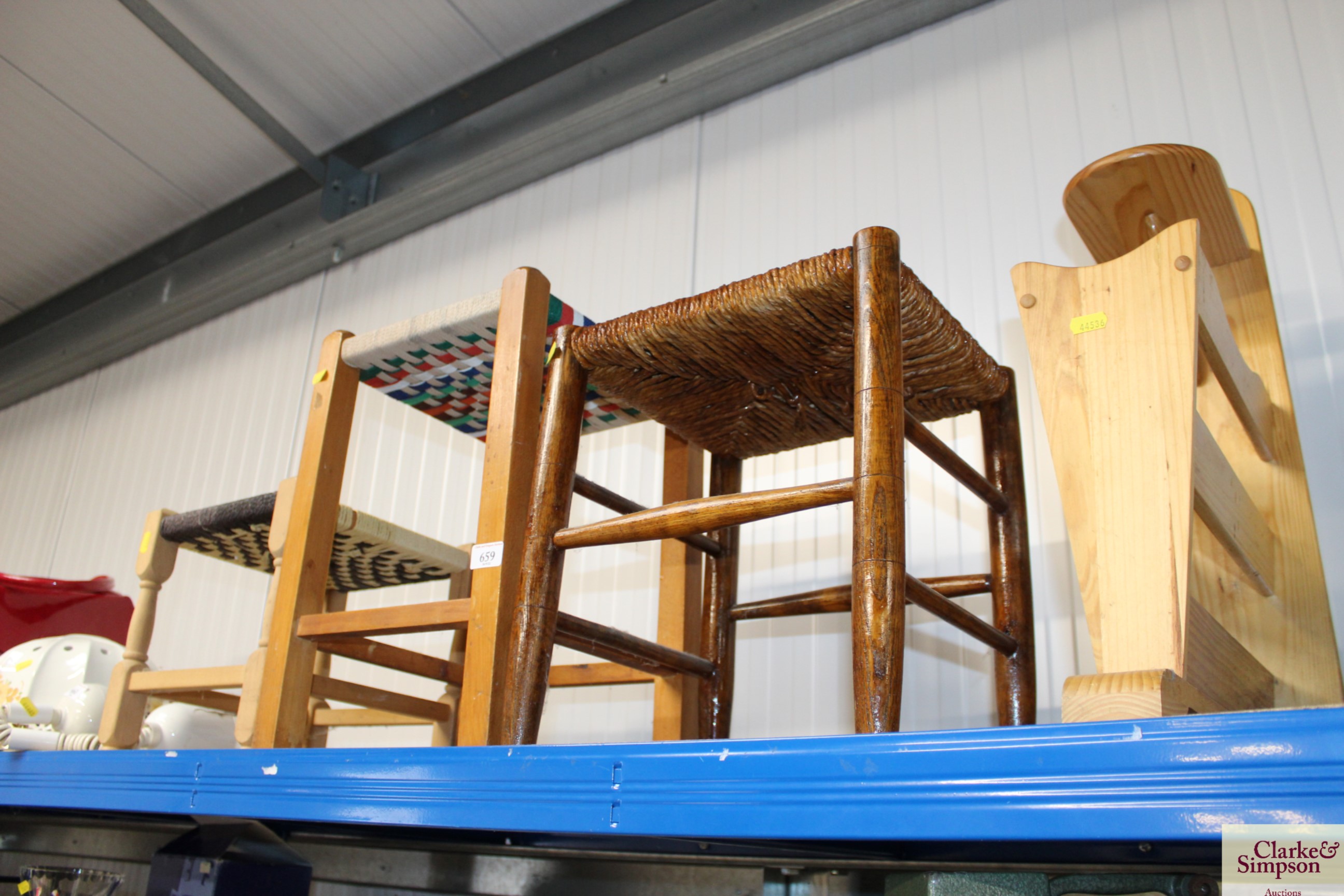 Three stools and a magazine rack