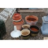 A quantity of ceramic and plastic plant pots