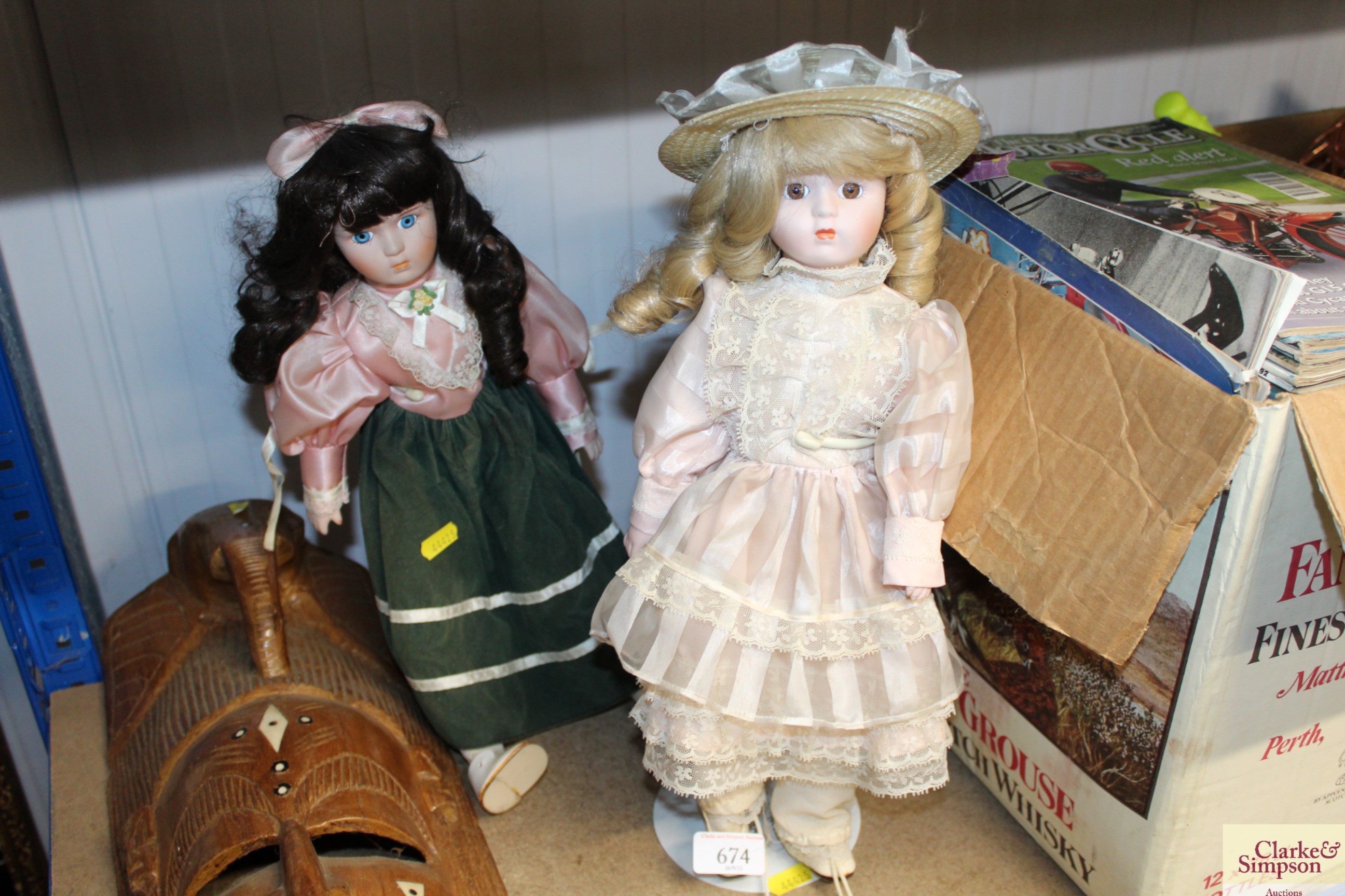 Two porcelain headed dress dolls