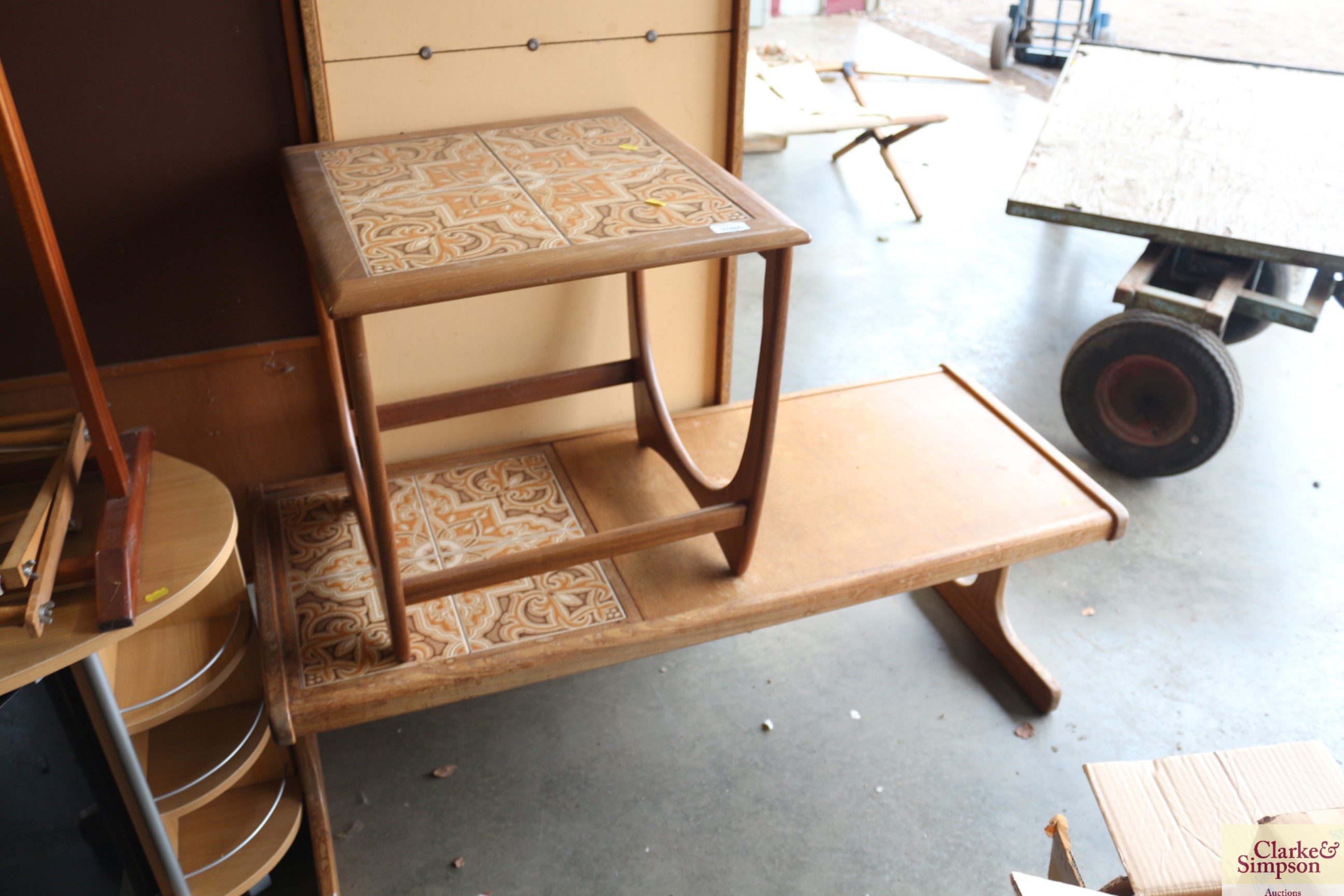 A teak and tile topped side table together with a