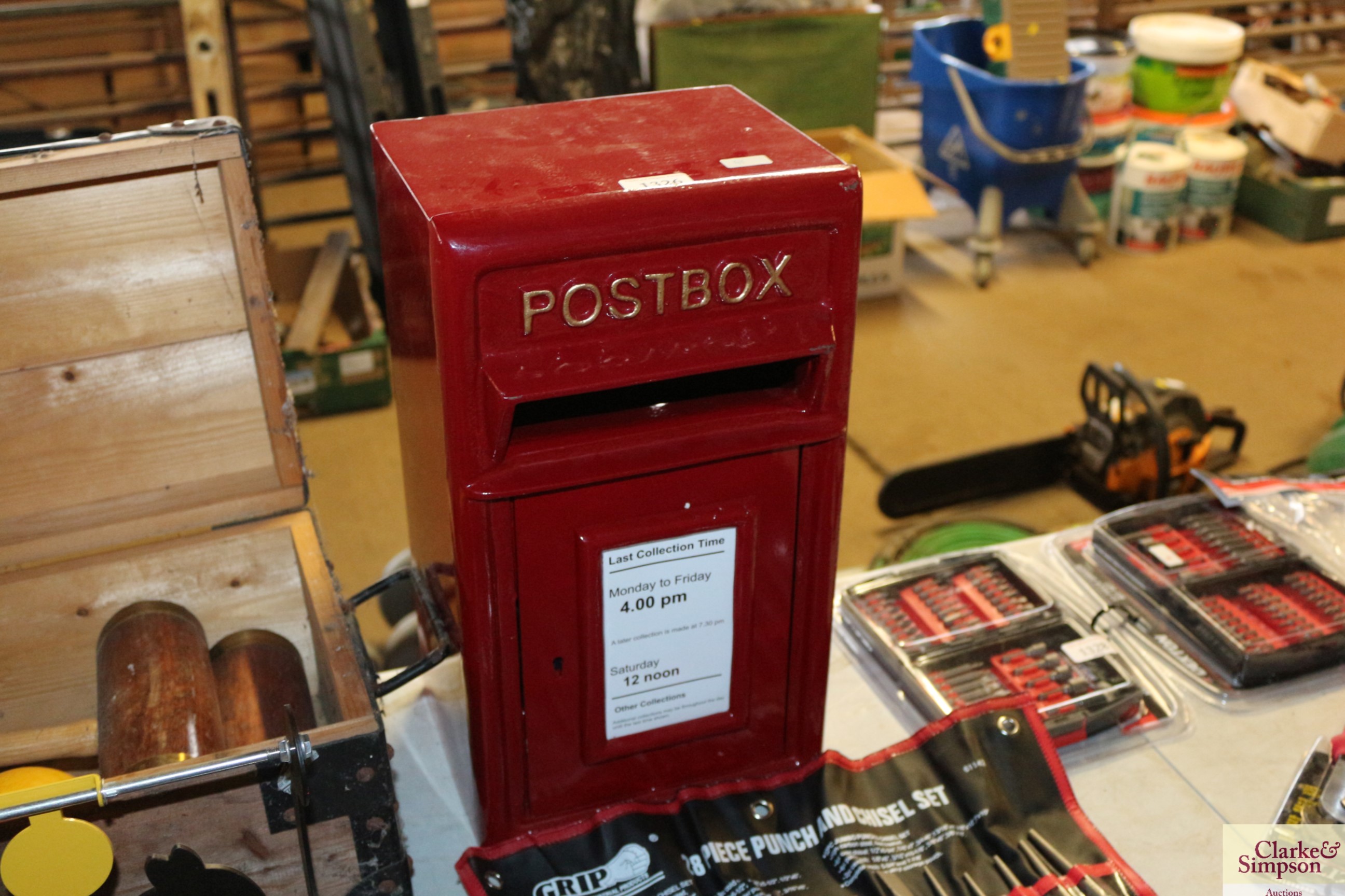 A red painted metal post box with key (42)