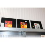 Three modern bevelled edge prints mounted to glass