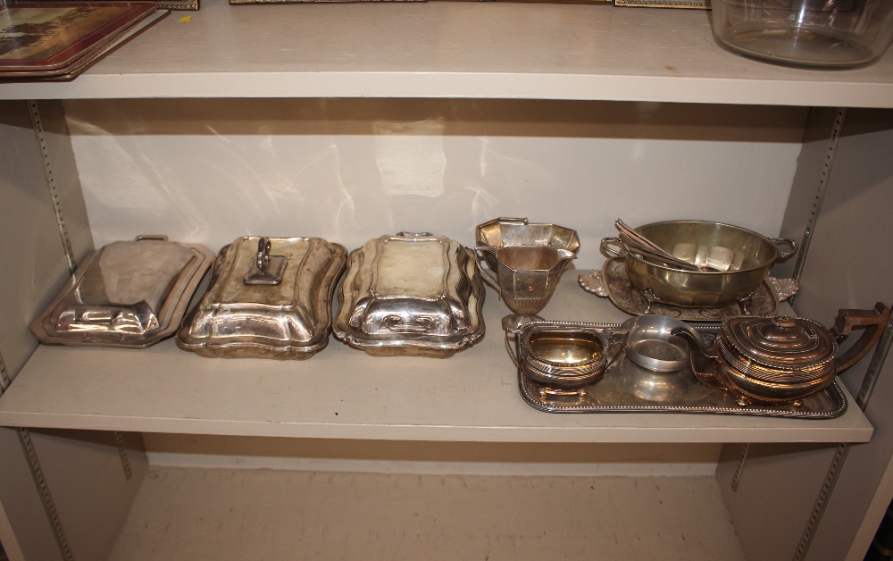 An oblong plated drinks tray with gadrooned border