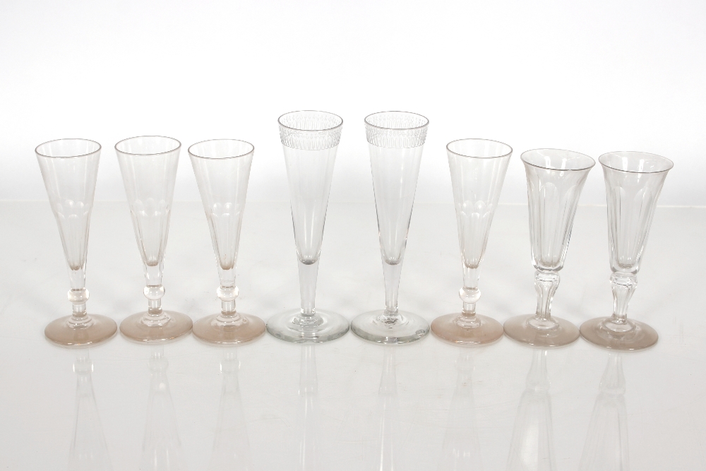 Eight 19th Century glass flutes