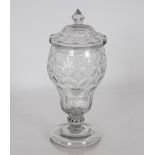 A 19th Century cut glass baluster sweetmeat jar and cover, the lid with spike shaped finial raised