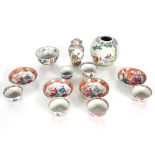 A collection of various Chinese tea bowls and saucers; a small Chinese baluster vase and cover;