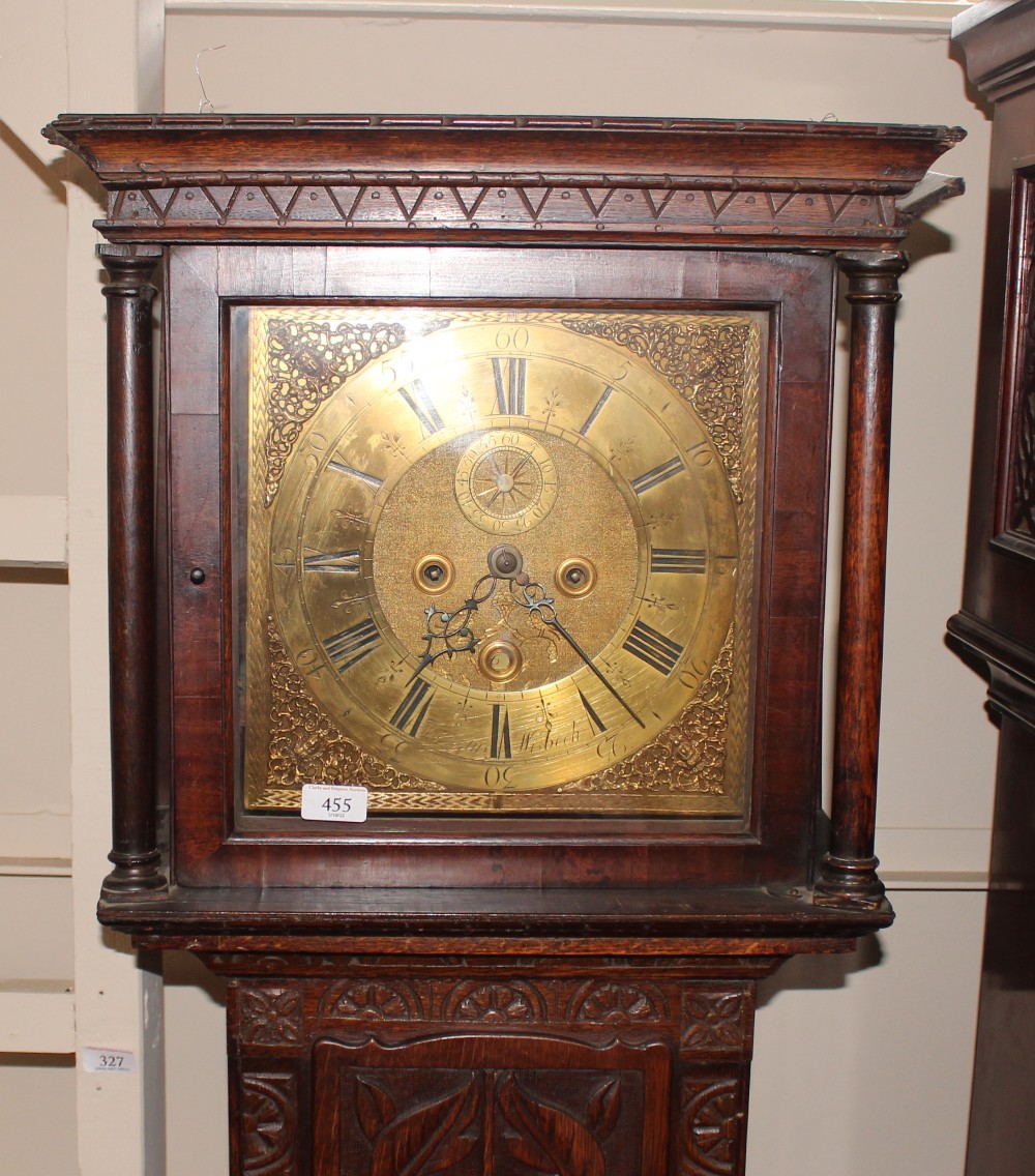 A carved oak longcase clock, the square brass spandrel dial inscribed "Thomas Loftus, Wisbech" eight