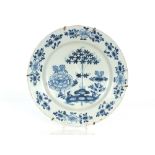 An 18th Century Delft shallow dish, having floral decoration, possibly Bristol, 37cm dia.