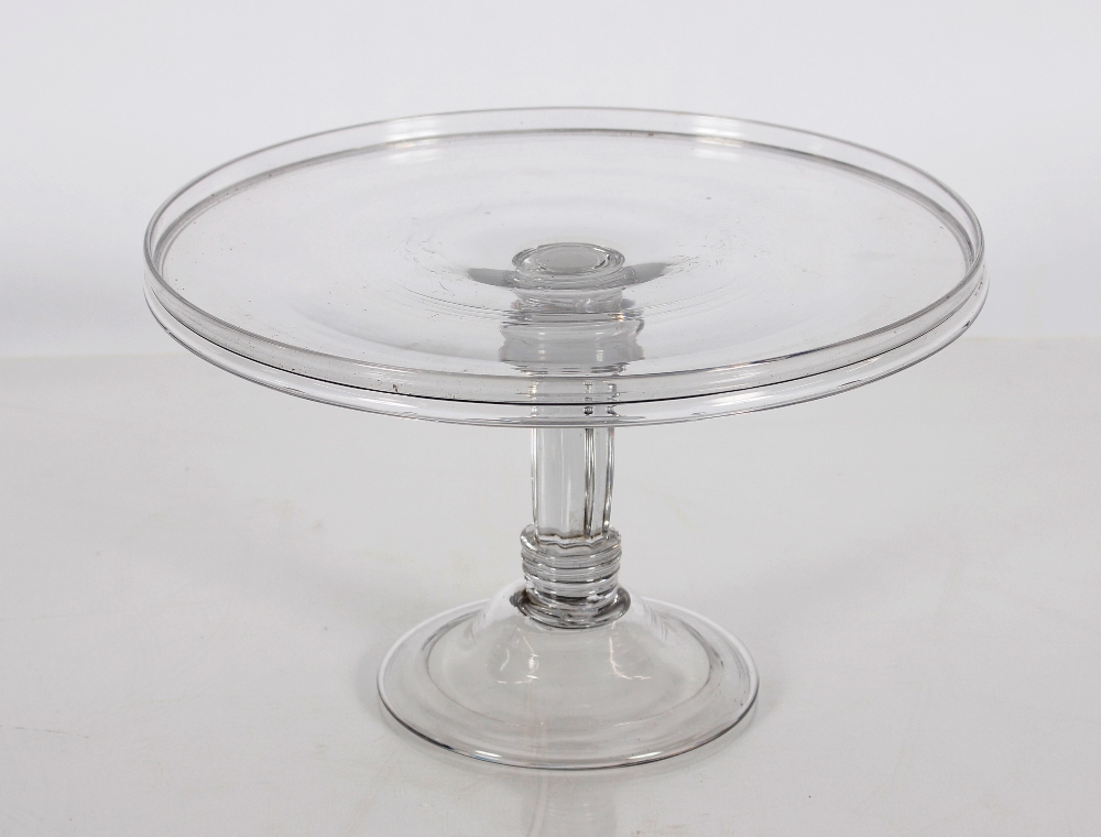 A good quality antique glass jelly stand, having circular dish top, raised on a fluted column on