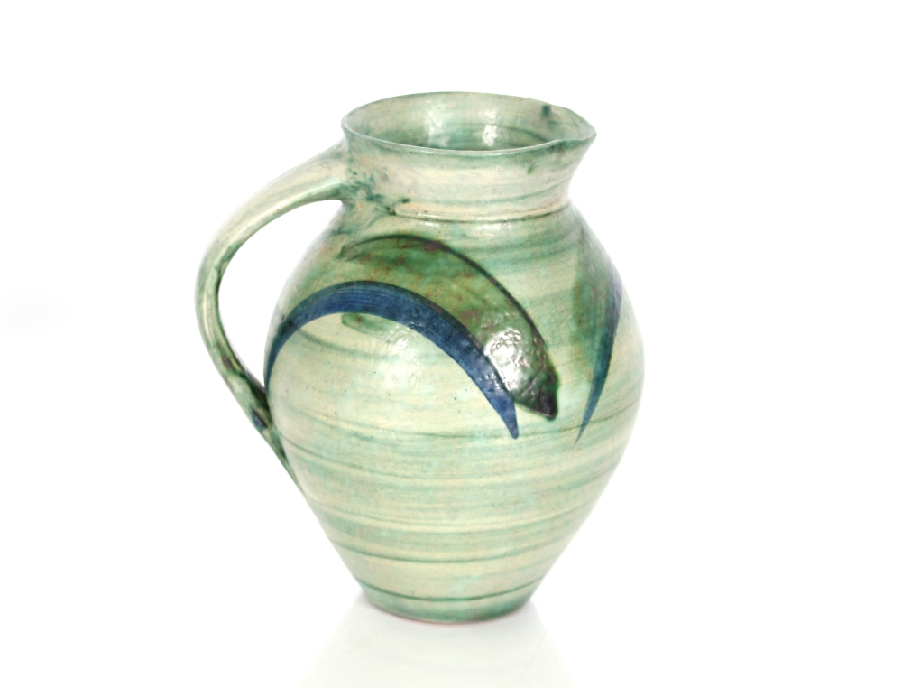 A Richard Phethean green glazed pottery jug, 23cm high