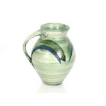 A Richard Phethean green glazed pottery jug, 23cm high