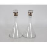 A pair of silver necked glass decanters with stoppers, 33cm high