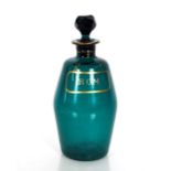A Victorian green glass rum decanter with gilt decoration, 21cm high
