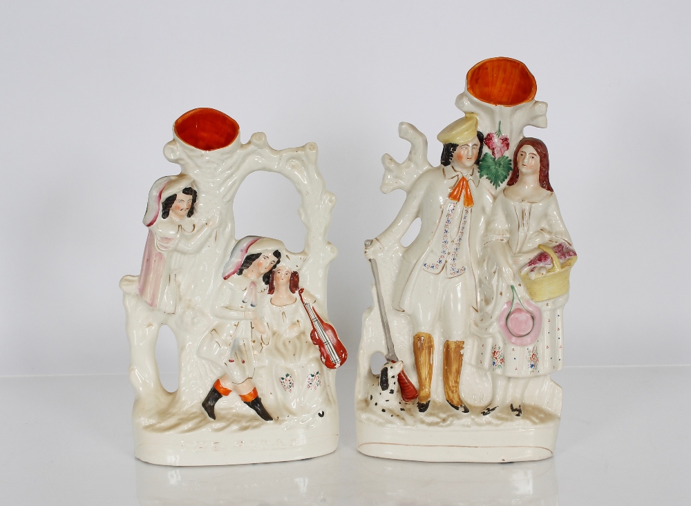 A Victorian Staffordshire flat back figural spill holder, "The Rival"; and another depicting