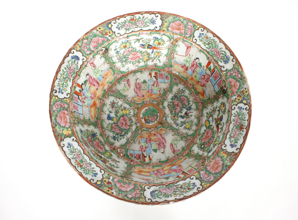 A large 19th Century Cantonese bowl decorated in the traditional manner, famille rose figures, birds