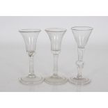 Three antique trumpet shaped wine glasses