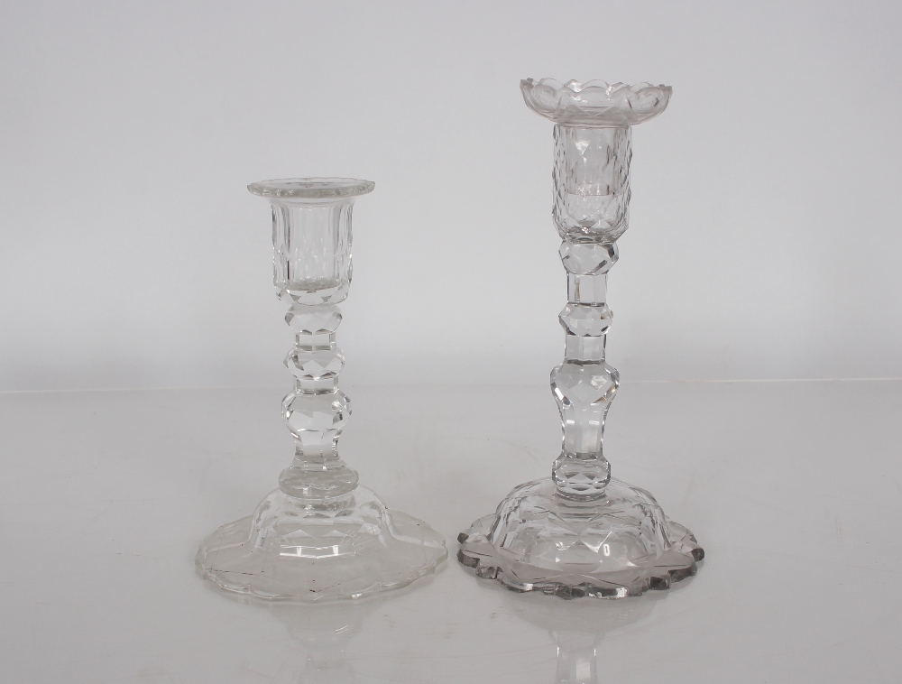 A 19th Century cut glass candlestick with detachable sconce, raised above faceted column and domed