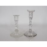 A 19th Century cut glass candlestick with detachable sconce, raised above faceted column and domed