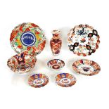 A Japanese Imari vase; six various Imari plates, and a bowl (8)