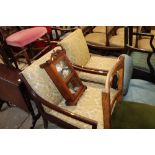 A pair of retro design armchairs