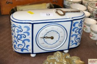 A Weimar / Lenzkirch blue and white china cased mantel timepiece