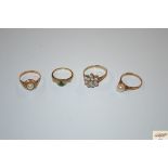 A 9ct gold open set ring, 2.9grams; A gold ring set green and white stones, 2grams; A 9ct gold and