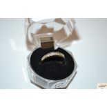 A 9ct gold and diamond half eternity ring