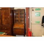 A 1930's oak bureau bookcase