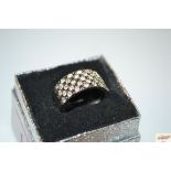 A boxed white metal and diamante set ring