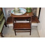 An Edwardian mahogany folding cake stand