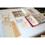 A box containing various stamps to include an albu