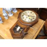 A small oak cased wall clock