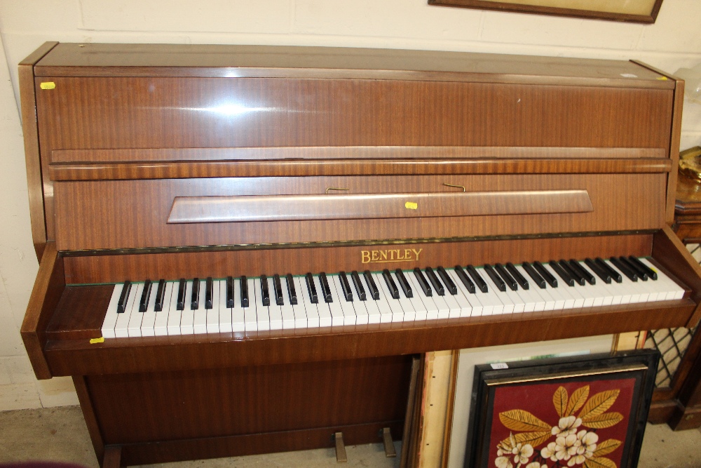 A Bentley upright piano no.125449
