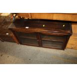 An oak glazed book cabinet