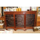 A reproduction mahogany dwarf break front bookcase