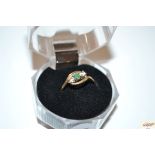 A 9ct gold cross over ring set with two diamonds a